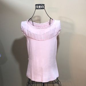 Pink sweater with detailed neckline